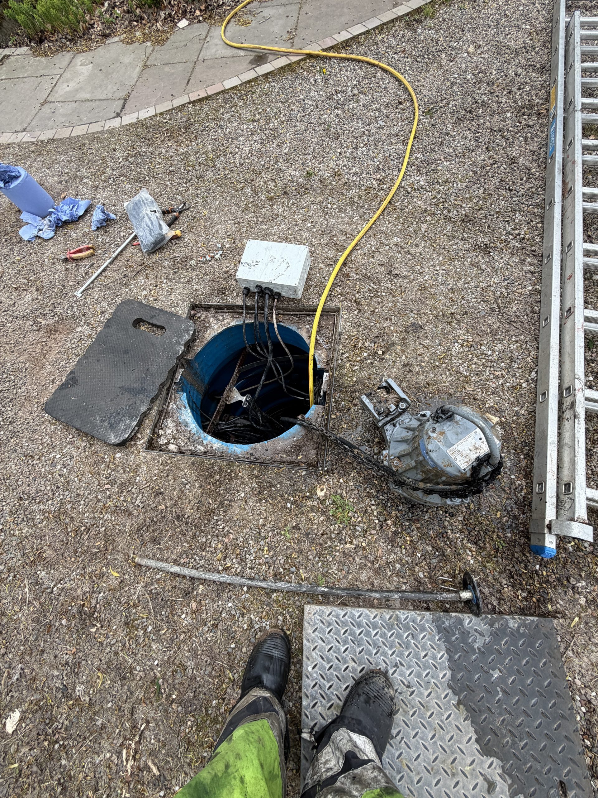 Flygt pump removed from chamber during repair in Fowlis Dundee